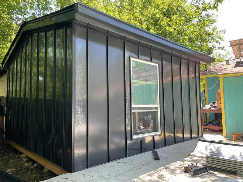 Black standing seam metal wall panels for Roof Inspection in New Albany